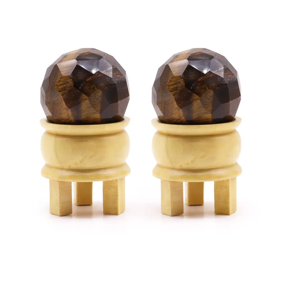 Boules facettées en pierre sur support : Œil de tigre